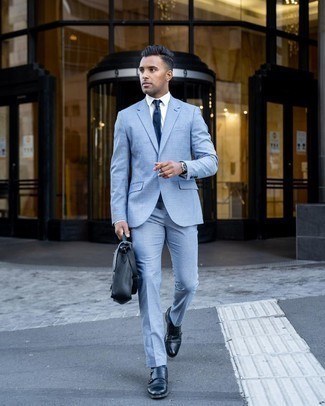 Light Blue Suit Outfits: This getup shows it is totally worth investing in such timeless menswear items as a light blue suit and a white dress shirt. Take your ensemble down a less formal path by finishing with navy leather double monks.