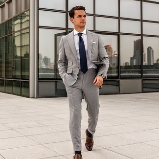 Dark Brown Leather Double Monks Outfits: This look shows it pays to invest in such timeless menswear items as a grey suit and a white dress shirt. For a more casual spin, why not complement this look with a pair of dark brown leather double monks?
