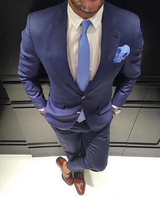 Light Blue Tie Outfits For Men: This pairing of a navy suit and a light blue tie is a life saver when you need to look like a true gentleman. A pair of brown leather monks will bring a laid-back aesthetic to the look.