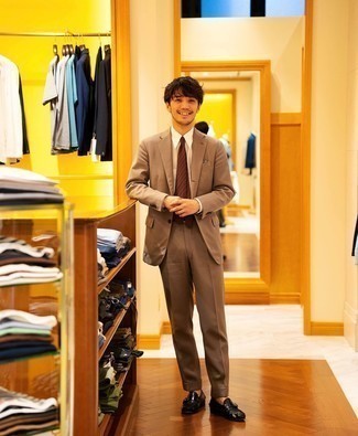500+ Dressy Warm Weather Outfits For Men: Marrying a tan suit with a white dress shirt is a nice pick for a smart and elegant look. You could perhaps get a bit experimental with footwear and dress down your getup with a pair of black leather loafers.