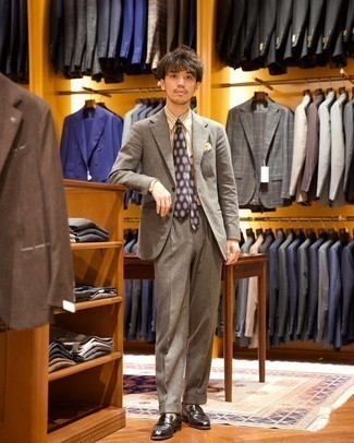 Grey Wool Suit Warm Weather Outfits: Pair a grey wool suit with a multi colored vertical striped dress shirt for truly stylish style. A pair of black leather loafers acts as the glue that will pull this ensemble together.