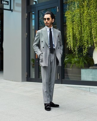 Black Tie Outfits For Men: Try teaming a grey check suit with a black tie for incredibly dapper style. Black embroidered velvet loafers are a simple way to inject a hint of stylish effortlessness into your outfit.