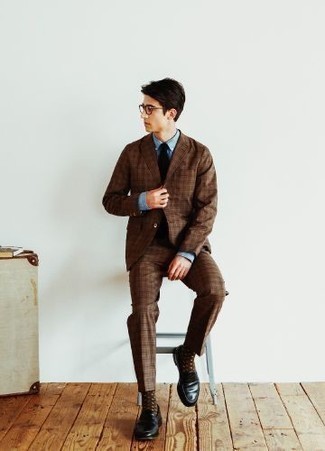 1200+ Dressy Outfits For Men: This polished combination of a brown plaid suit and a light blue chambray dress shirt is truly a statement-maker. A pair of black leather loafers is a wonderful pick to complete this ensemble.