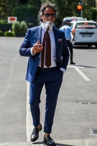 Burgundy Pocket Square Dressy Outfits: Choose a navy vertical striped suit and a burgundy pocket square for a cool and casual and trendy getup. And if you wish to immediately step up this outfit with a pair of shoes, why not introduce black leather loafers to your getup?