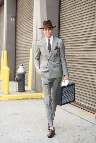 Grey Vertical Striped Suit Outfits: Rock a grey vertical striped suit with a white dress shirt for seriously sharp attire. Dark purple leather loafers tie the getup together.