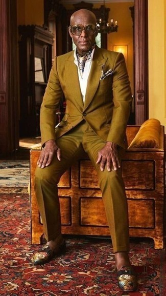 Multi colored Silk Scarf Outfits For Men: This pairing of a mustard suit and a multi colored silk scarf is a safe bet for a seriously cool ensemble. Tone down the casualness of your outfit by slipping into multi colored print canvas loafers.