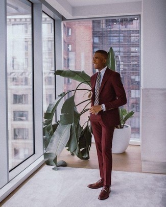 Burgundy Suit Outfits: This sophisticated combo of a burgundy suit and a light blue dress shirt is a frequent choice among the style-conscious chaps. Burgundy leather loafers will give a playful touch to your look.