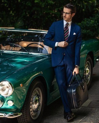 Navy Leather Briefcase Outfits: The mix-and-match capabilities of a navy suit and a navy leather briefcase ensure you'll always have them on permanent rotation in your menswear arsenal. If you want to break out of the mold a little, introduce black leather loafers to this look.