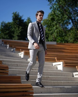Black and White Horizontal Striped Tie Outfits For Men: For an outfit that's dapper and GQ-worthy, team a grey check suit with a black and white horizontal striped tie. Rounding off with a pair of black fringe leather loafers is the simplest way to bring a more casual spin to this look.