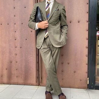 Zip Pouch Outfits For Men: For an ensemble that's super straightforward but can be modified in a variety of different ways, team an olive suit with a zip pouch. Brown suede loafers are a simple way to punch up this outfit.