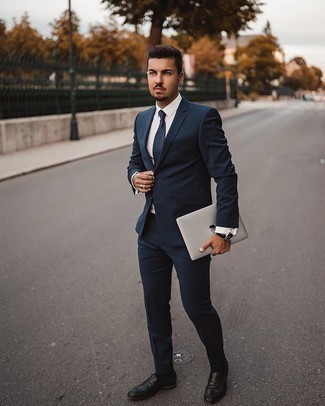 Navy Tie Outfits For Men: A navy suit and a navy tie are absolute must-haves if you're putting together a smart wardrobe that matches up to the highest sartorial standards. Want to dial it down with shoes? Opt for black leather loafers for the day.