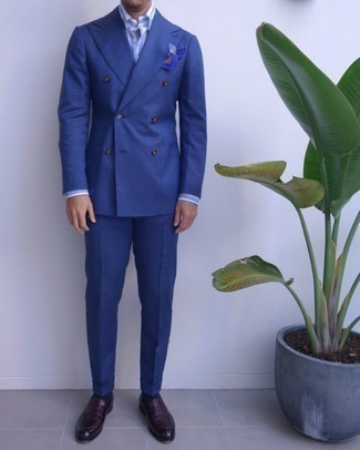 Blue Suit Outfits: You'll be surprised at how super easy it is to get dressed this way. Just a blue suit matched with a white and blue vertical striped dress shirt. Complete your ensemble with burgundy leather loafers and the whole look will come together.