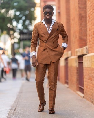 Brown Fringe Leather Loafers Outfits For Men: Dress in a tobacco suit and a white and blue vertical striped dress shirt if you're aiming for a clean-cut, sharp outfit. A great pair of brown fringe leather loafers ties this outfit together.