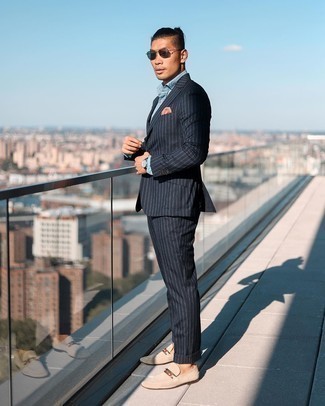 Black Vertical Striped Suit Outfits: Consider teaming a black vertical striped suit with a light blue chambray dress shirt for a sleek classy look. If you're hesitant about how to finish off, a pair of beige suede loafers is a great pick.