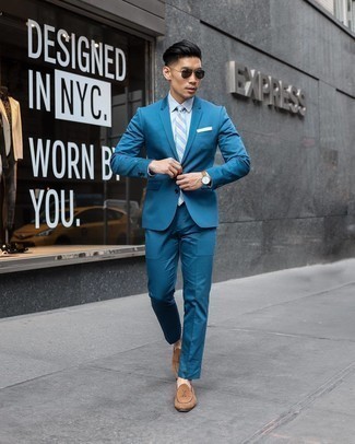 Light Blue Suit Outfits: This is undeniable proof that a light blue suit and a light blue vertical striped dress shirt look amazing when matched together in a classy outfit for today's man. A pair of brown suede loafers finishes this getup very well.