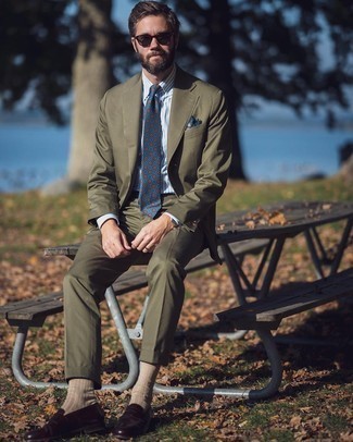 Olive Suit Outfits: Loving the way this combo of an olive suit and a white and blue vertical striped dress shirt immediately makes you look sophisticated and dapper. If you're puzzled as to how to finish, a pair of burgundy leather loafers is a smart option.