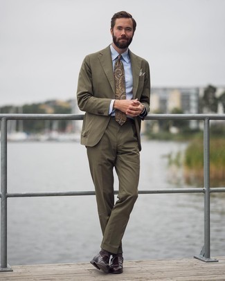 Tan Paisley Tie Outfits For Men: Pairing an olive suit and a tan paisley tie is a fail-safe way to infuse personality into your day-to-day styling collection. Switch up your look with a pair of dark brown leather loafers.