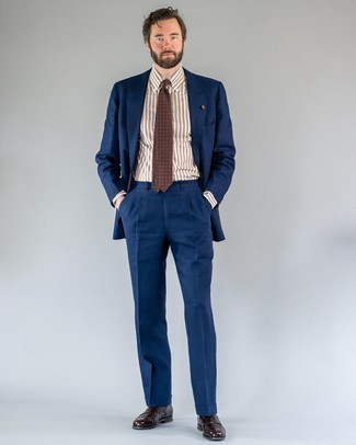 Dark Brown Socks Outfits For Men: This combo of a navy suit and dark brown socks is put together and yet it looks easy enough and ready for anything. With footwear, go for something on the classier end of the spectrum by finishing off with dark brown leather loafers.