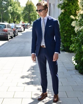 Grey Floral Tie Outfits For Men: Loving the way this combo of a navy suit and a grey floral tie instantly makes men look refined and smart. To introduce a hint of stylish effortlessness to your look, introduce a pair of brown leather loafers to the equation.