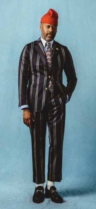 Dark Brown Vertical Striped Suit Outfits: Pairing a dark brown vertical striped suit with a white and blue vertical striped dress shirt is an amazing choice for a smart and classy look. If not sure as to the footwear, add a pair of dark brown suede loafers to this look.