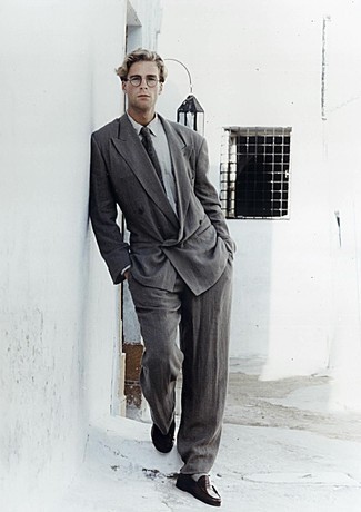 Charcoal Suit Outfits: Channel your inner James Bond and consider wearing a charcoal suit and a grey dress shirt. You can get a little creative on the shoe front and dial down your outfit by wearing black leather loafers.