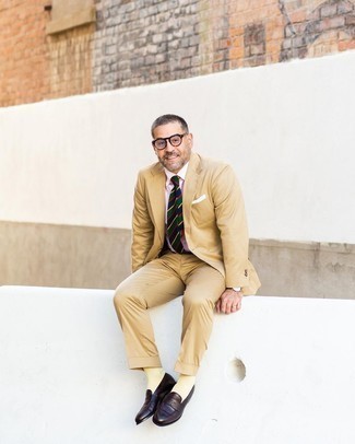 500+ Outfits For Men After 40: Marrying a tan suit with a pink dress shirt is a smart option for a classic and elegant outfit. Introduce a playful vibe to by slipping into a pair of dark brown leather loafers. Dressing inspiration like this will help you stay enviously fashionable way into your 40s.