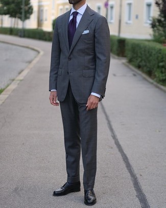 Violet Tie Outfits For Men: Loving the way this combo of a charcoal check suit and a violet tie instantly makes any guy look stylish and polished. Feeling transgressive? Spice things up by wearing a pair of black leather loafers.