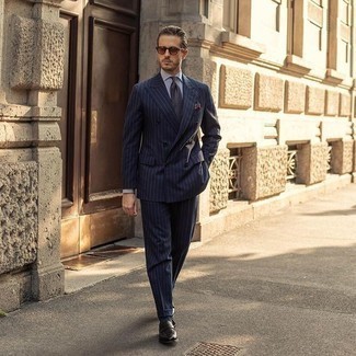 Brown Sunglasses Outfits For Men: Want to inject your menswear arsenal with some effortless cool? Wear a navy vertical striped suit with brown sunglasses. If you wish to immediately kick up this ensemble with one single piece, complete this outfit with a pair of black leather loafers.