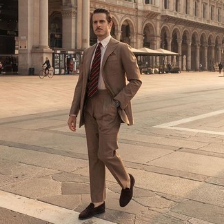 Red Tie Outfits For Men: When it comes to high-octane smart style, this pairing of a brown suit and a red tie is the ultimate style. Introduce a pair of dark brown suede loafers to the equation to easily dial up the appeal of this look.