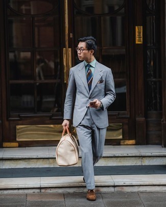 500+ Dressy Outfits For Men: For an outfit that's refined and Bond-worthy, rock a grey suit with a green vertical striped dress shirt. A pair of brown suede loafers is a great pick to round off this outfit.