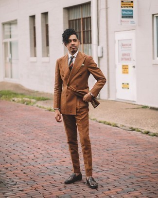 Brown Suit Outfits: For an ensemble that's absolutely Kingsman-worthy, consider wearing a brown suit and a white dress shirt. To give your overall ensemble a more laid-back twist, add dark brown leather loafers to the mix.