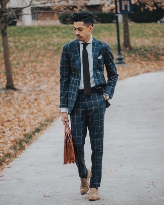 Watch Outfits For Men: To don a casual look with a twist, try pairing a navy check suit with a watch. Complement this outfit with a pair of tan suede loafers to effortlessly amp up the classy factor of any look.