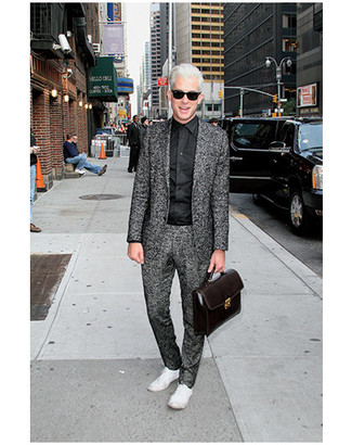 Mark Ronson wearing Charcoal Wool Suit, Black Dress Shirt, White Low Top Sneakers, Black Leather Briefcase