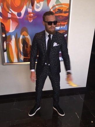 Conor McGregor wearing Charcoal Camouflage Suit, White Dress Shirt, Black Leather Low Top Sneakers, Black Tie