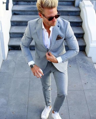 White Leather Low Top Sneakers Dressy Outfits For Men: To look like a British gent, rock a grey suit with a white dress shirt. If you want to immediately tone down your outfit with one single item, why not introduce a pair of white leather low top sneakers to the mix?
