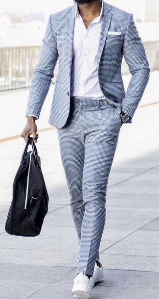 Light Blue Suit Outfits: Team a light blue suit with a white dress shirt for seriously classic style. Rev up the wow factor of your outfit by slipping into a pair of white canvas low top sneakers.