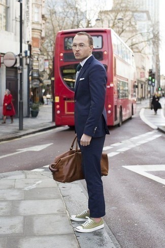 Men's Navy Suit, White Dress Shirt, Olive Canvas Low Top Sneakers, Brown Leather Duffle Bag