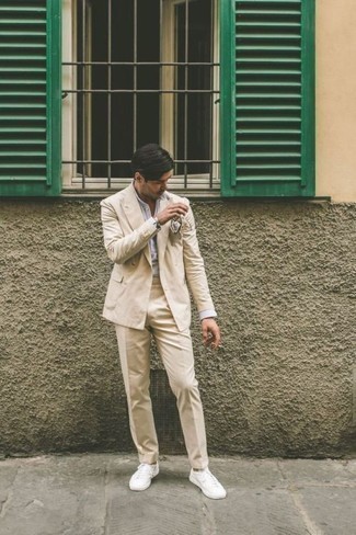 Tan Suit Smart Casual Outfits: Marry a tan suit with a white and blue vertical striped dress shirt for a sleek polished ensemble. Tone down the dressiness of your getup by slipping into white canvas low top sneakers.