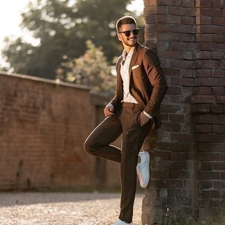 White and Black Low Top Sneakers Dressy Outfits For Men: This pairing of a brown suit and a white dress shirt will add manly essence to your outfit. For something more on the casually cool end to complete this ensemble, introduce white and black low top sneakers to the equation.