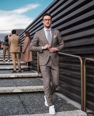 Charcoal Tie Outfits For Men: A brown vertical striped suit and a charcoal tie? Be sure, this ensemble will turn every head in the room. Complete your ensemble with a pair of white canvas low top sneakers to give a hint of stylish nonchalance to your look.