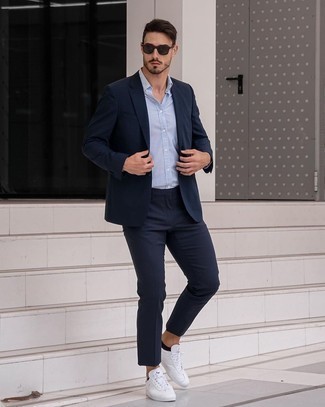 Blue Sunglasses Warm Weather Outfits For Men: Seriously stylish yet comfy, this ensemble is comprised of a navy suit and blue sunglasses. As for shoes, opt for a pair of white canvas low top sneakers.