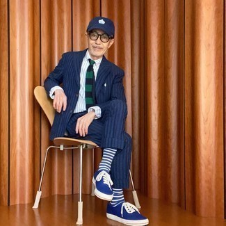 Men's Navy Vertical Striped Suit, White and Navy Vertical Striped Dress Shirt, Blue Canvas Low Top Sneakers, Navy Print Baseball Cap