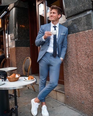 Blue Suit Outfits: No doubt, you'll look seriously dapper in a blue suit and a white dress shirt. Bring a more casual finish to by rocking a pair of white canvas low top sneakers.