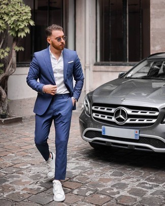 Blue Suit Outfits: Swing into something dapper and timeless with a blue suit and a white dress shirt. A trendy pair of white and black leather low top sneakers is the most effective way to transform your look.