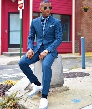 Navy Plaid Dress Shirt Outfits For Men: This classy combination of a navy plaid dress shirt and a blue suit is a popular choice among the style-conscious men. For something more on the cool and laid-back end to finish your look, complete this look with a pair of white canvas low top sneakers.