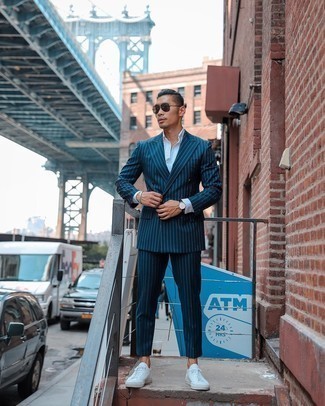 Navy Vertical Striped Suit Outfits: This sophisticated pairing of a navy vertical striped suit and a white dress shirt is a popular choice among the dapper chaps. To inject a more casual feel into this outfit, introduce white canvas low top sneakers to the mix.