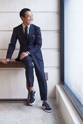 White and Navy Pocket Square Outfits: This laid-back combination of a navy suit and a white and navy pocket square is ideal when you need to look nice but have no extra time to spare. Let your sartorial savvy truly shine by rounding off this outfit with a pair of navy and white canvas low top sneakers.