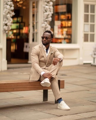 Dark Brown Sunglasses Outfits For Men: Hard proof that a tan check suit and dark brown sunglasses look awesome when worn together in an off-duty outfit. On the footwear front, this outfit is rounded off nicely with white canvas low top sneakers.
