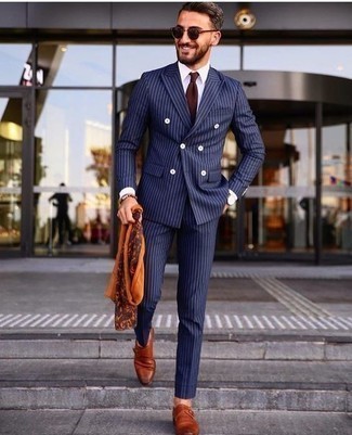 Orange Scarf Outfits For Men: Consider teaming a navy vertical striped suit with an orange scarf for both sharp and easy-to-achieve look. To add a little depth to this outfit, add tobacco leather monks to the equation.