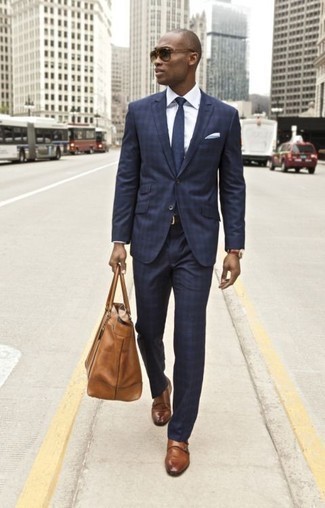 Beige Leather Tote Bag Outfits For Men: Who said you can't make a stylish statement with a relaxed look? Draw the attention in a navy plaid suit and a beige leather tote bag. And if you need to immediately perk up this outfit with shoes, why not complement this look with a pair of brown leather monks?